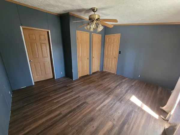 a view of a room with a ceiling fan