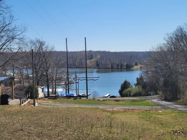 a view of a lake with a house in the background