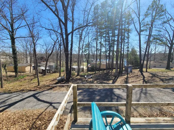 a view of a yard with cars