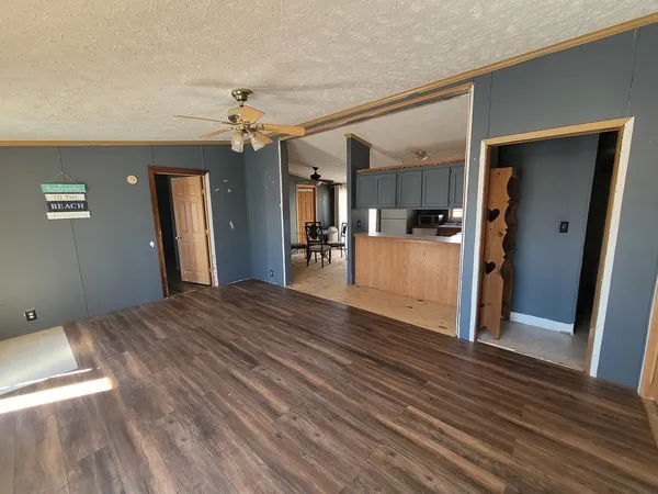 a view interior of a house wooden floor and a kitchen space
