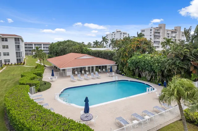 a front view of a building with outdoor seating