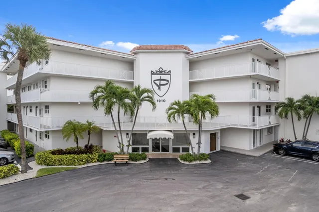 a view of a swimming pool with a yard