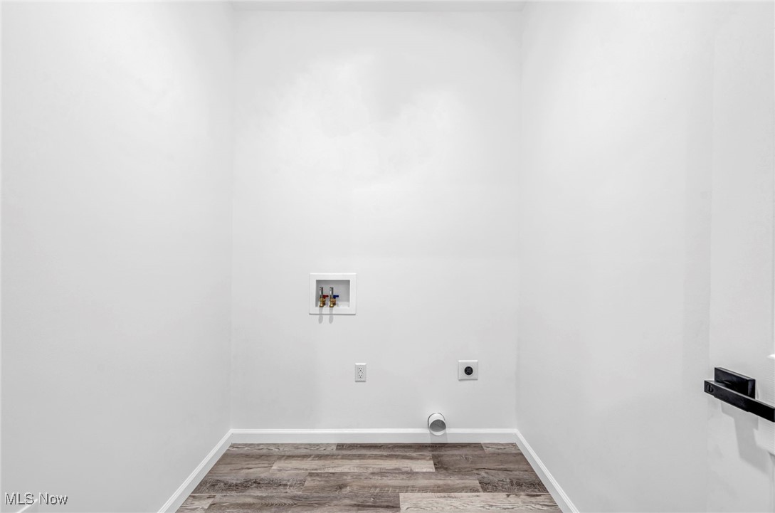 3709 Sudbury Road Cleveland, OH 44120 - Photo 25 of 29 Laundry area featuring washer hookup, wood-type flooring, and hookup for an electric dryer