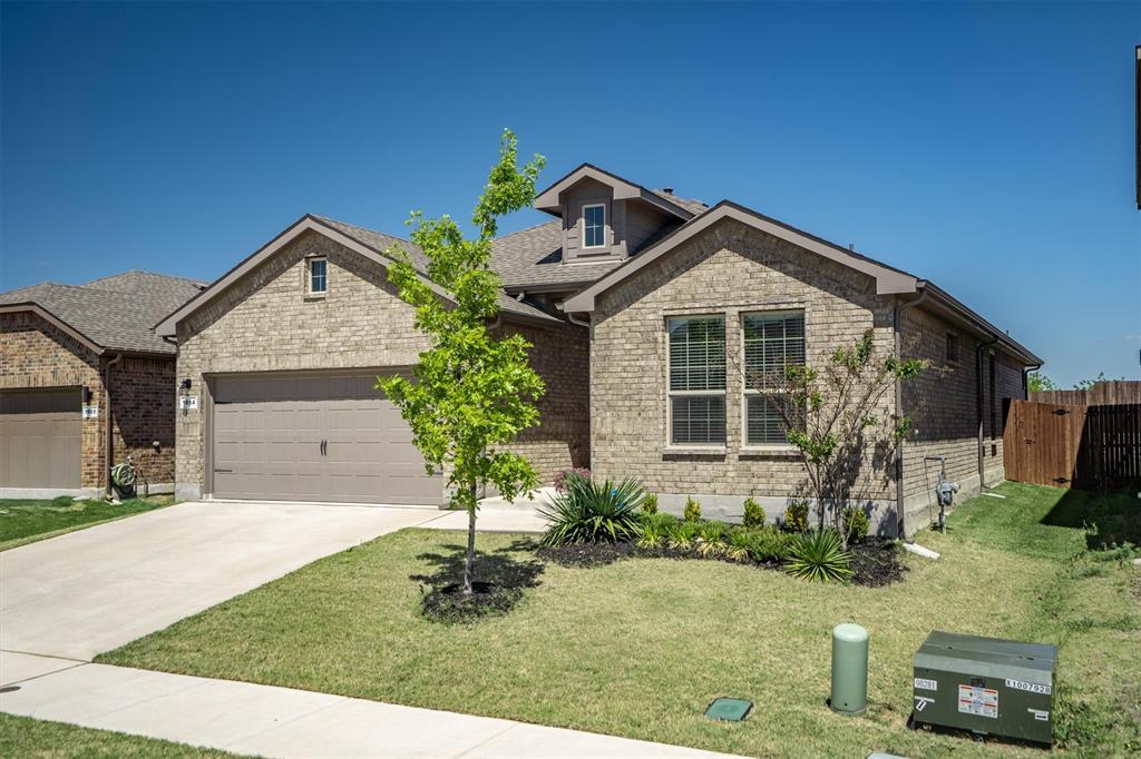 1864 Mensa Drive Haslet, TX 76052 - Photo 5 of 40 a front view of a house with garden