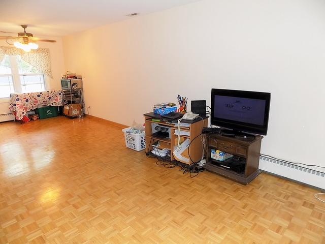 486 Raupp Boulevard Buffalo Grove, IL 60089 - Photo 6 of 16 a view of a room with a flat screen tv