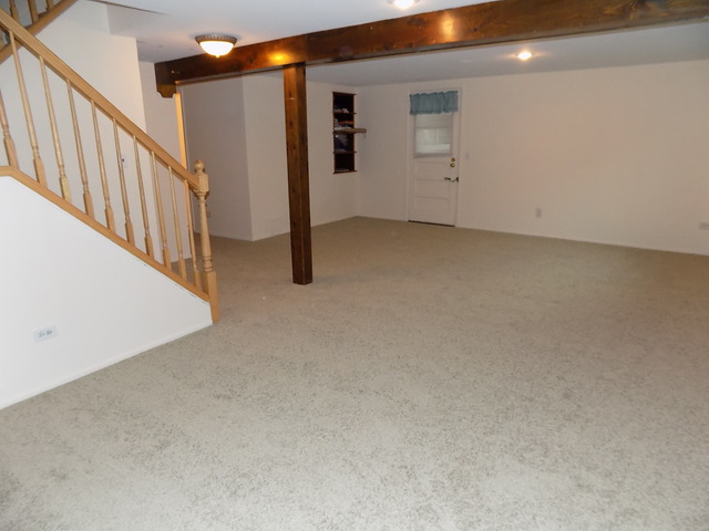 486 Raupp Boulevard Buffalo Grove, IL 60089 - Photo 9 of 16 wooden floor in an empty room