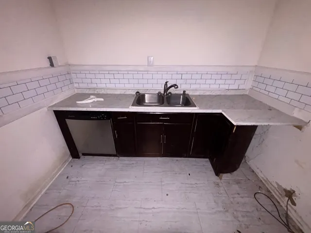 a kitchen with a sink and cabinets