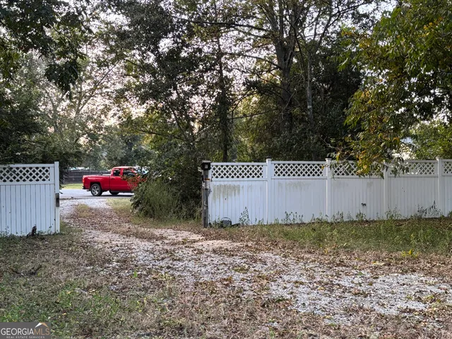 a view of a yard with an outdoor space