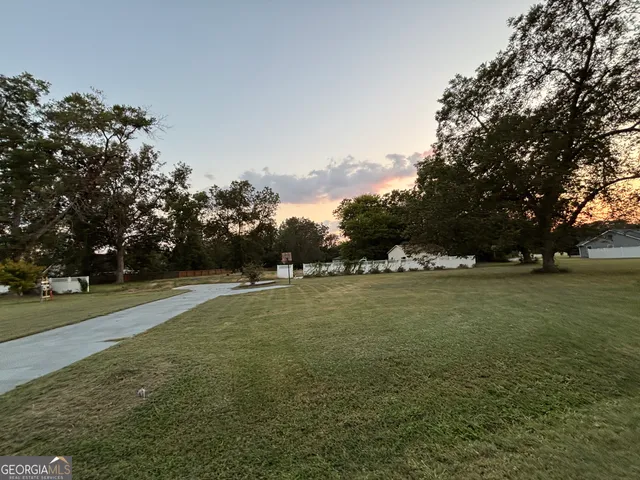 a view of field with trees