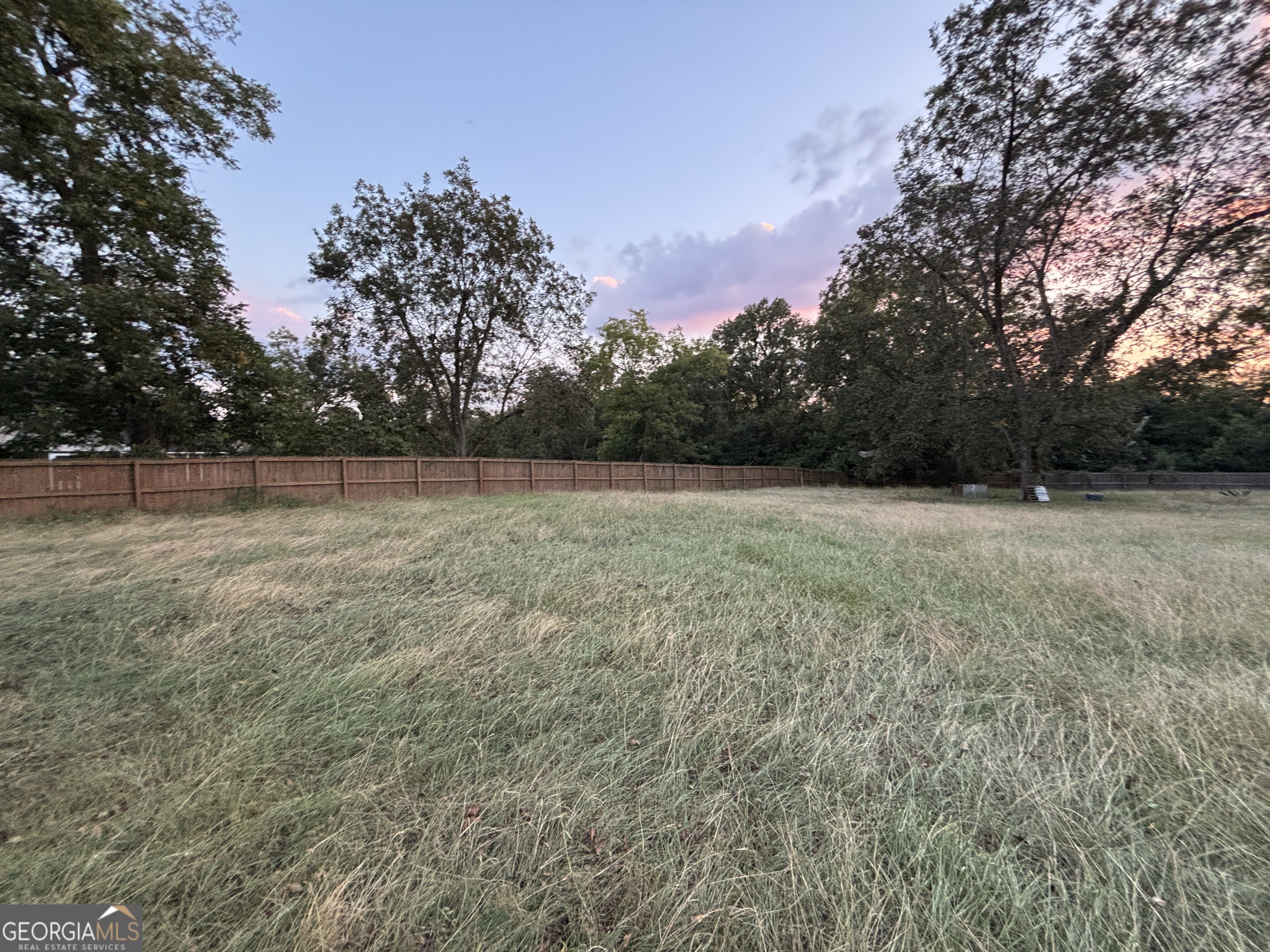 140 Racetrack Drive Cochran, GA 31014 - Photo 9 of 33 a view of a field with trees in the background