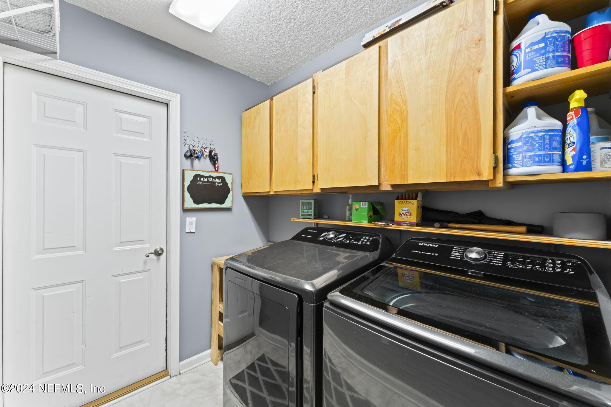 1977 Protection Point Fleming Island, FL 32003 - Photo 45 of 84 Laundry Room w/ Cabinetry