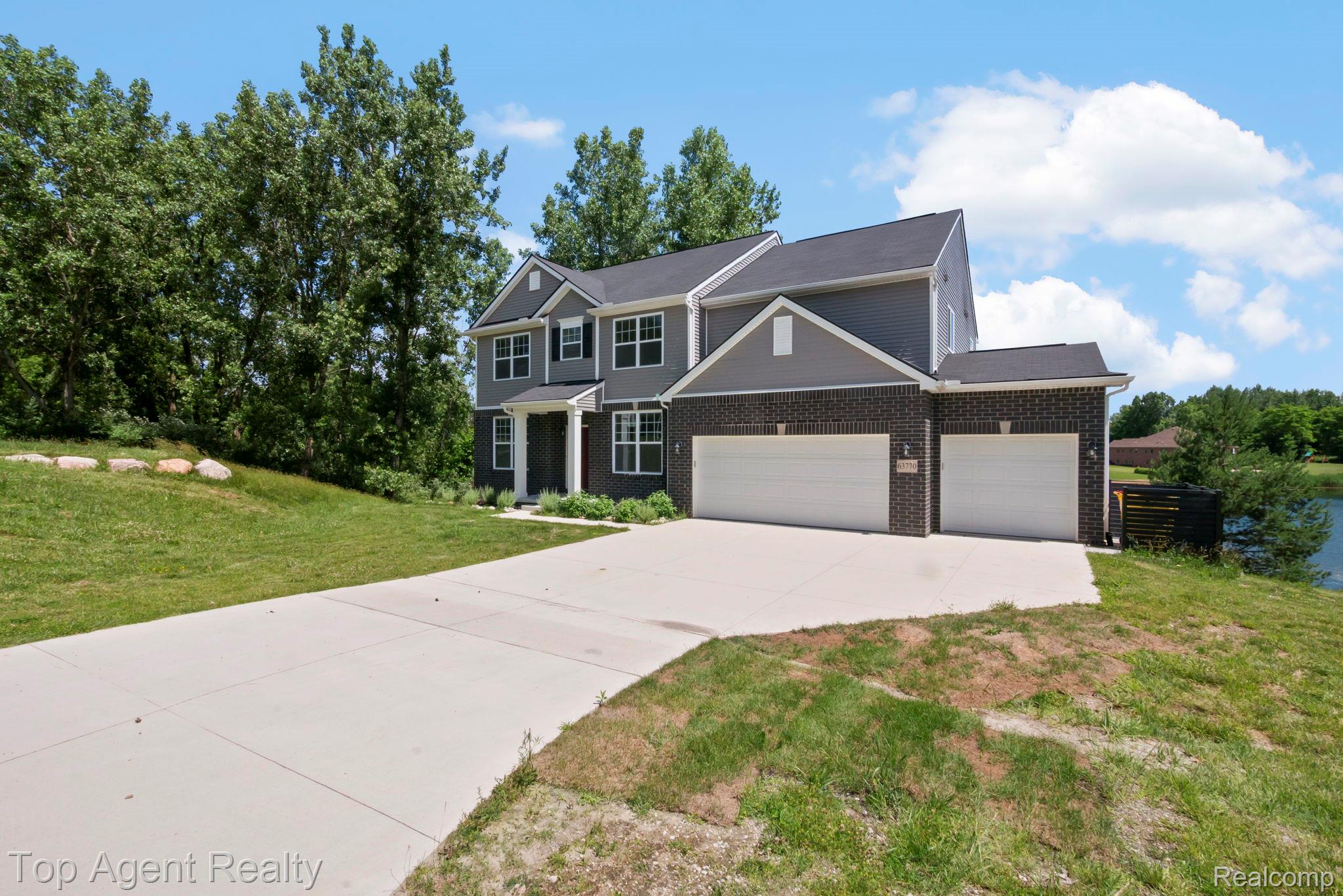 63770 Dequindre Road Washington, MI 48095 - Photo 56 of 61 Contemporary two-story residence featuring dark brick and gray siding