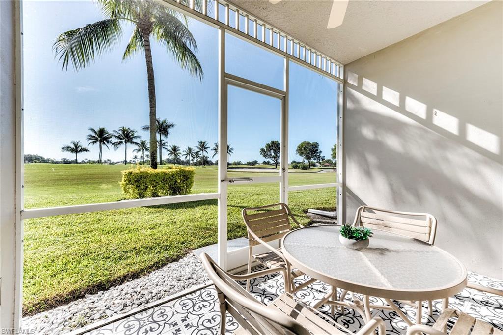 7955 Mahogany Run Lane, Unit 514 Naples, FL 34113 - Photo 17 of 30 a view of a swimming pool with chairs