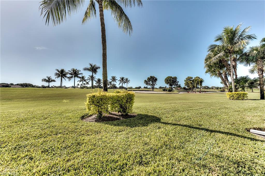 7955 Mahogany Run Lane, Unit 514 Naples, FL 34113 - Photo 18 of 30 a view of a swimming pool and an ocean