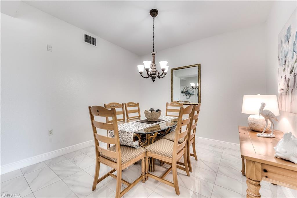 7955 Mahogany Run Lane, Unit 514 Naples, FL 34113 - Photo 5 of 30 a dining room with furniture and window