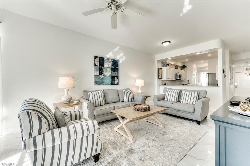 7955 Mahogany Run Lane, Unit 514 Naples, FL 34113 - Photo 7 of 30 a living room with furniture