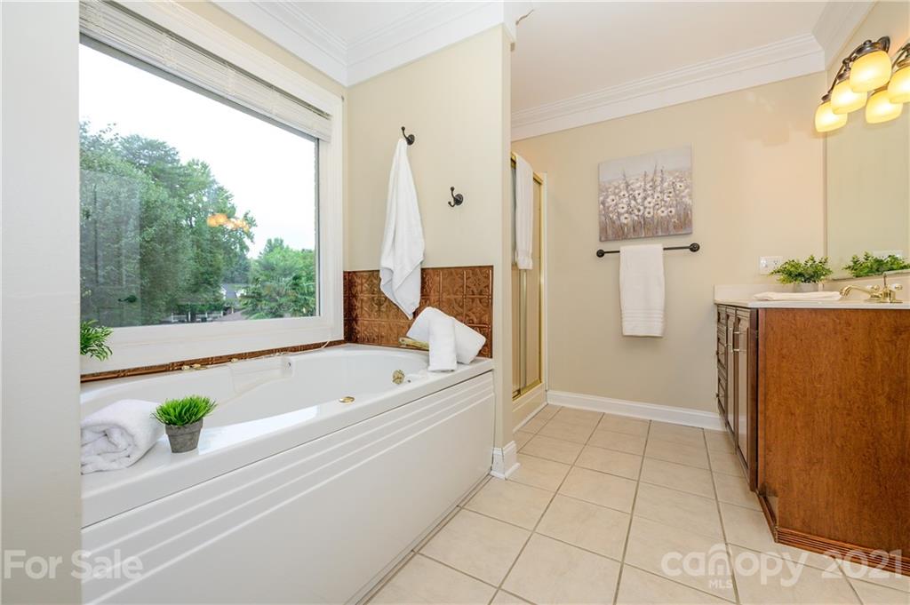 8456 Fairfield Forest Road Denver, NC 28037 - Photo 24 of 38 a bathroom with a bathtub and shower