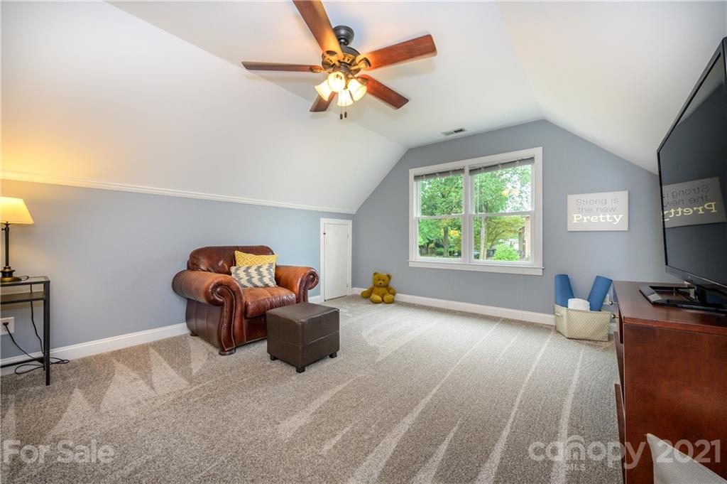 8456 Fairfield Forest Road Denver, NC 28037 - Photo 27 of 38 a living room with furniture and a window