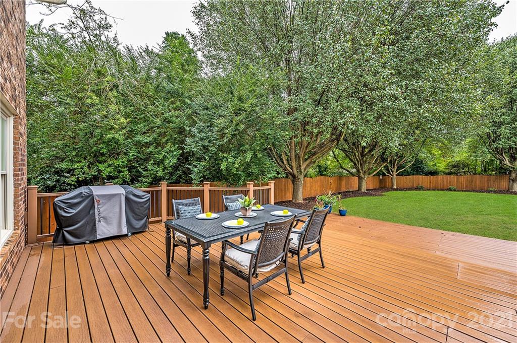 8456 Fairfield Forest Road Denver, NC 28037 - Photo 31 of 38 a view of a dinning table and chairs on roof deck