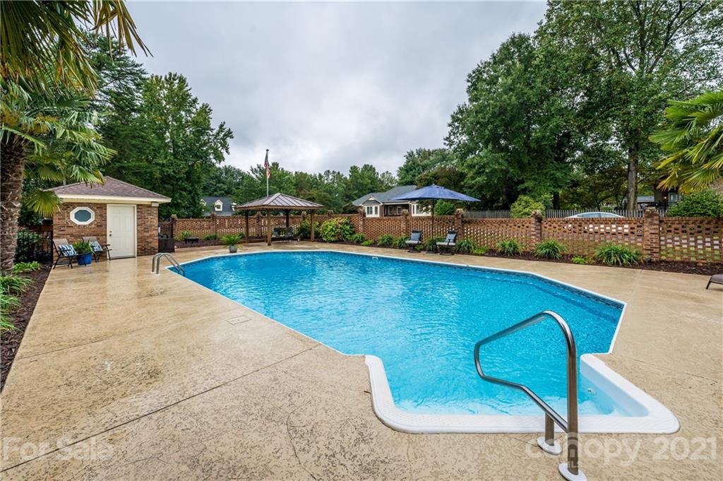 8456 Fairfield Forest Road Denver, NC 28037 - Photo 35 of 38 a view of a swimming pool with lounge chair