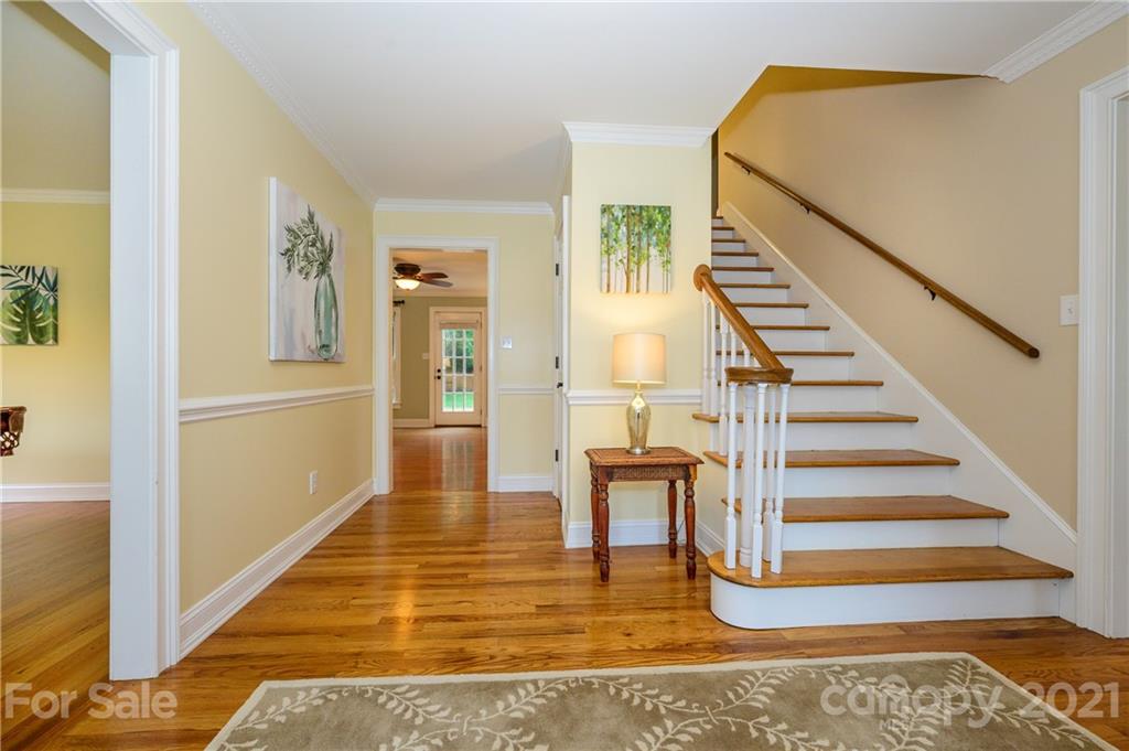 8456 Fairfield Forest Road Denver, NC 28037 - Photo 5 of 38 a view of entryway and hall with wooden floor