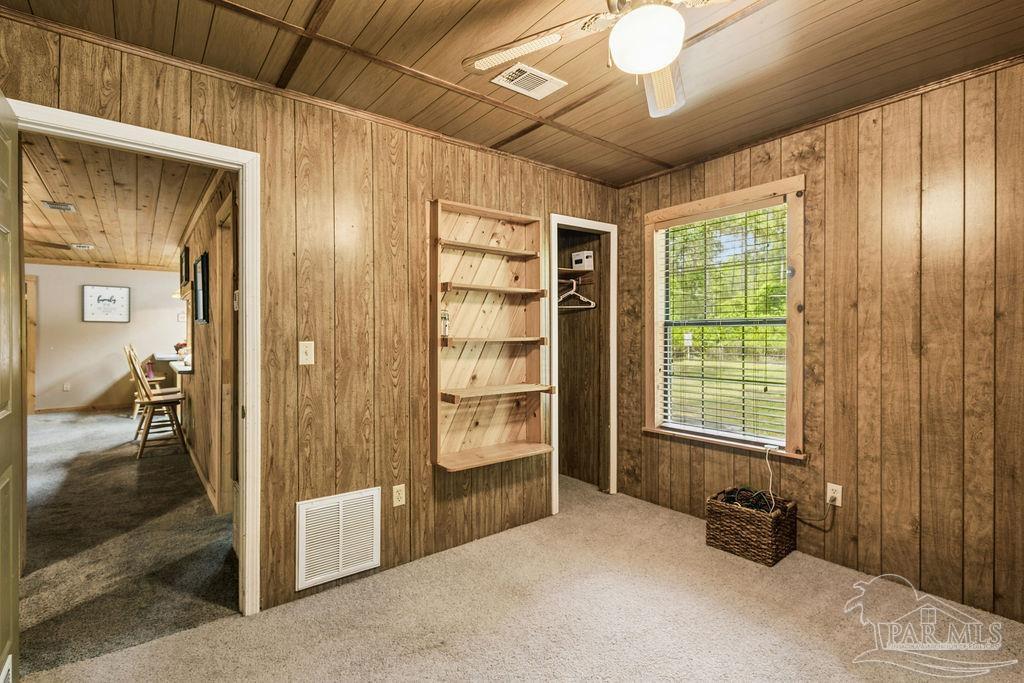 8938 Pioneer Road Holt, FL 32564 - Photo 24 of 44 a view of a livingroom with a furniture and a window