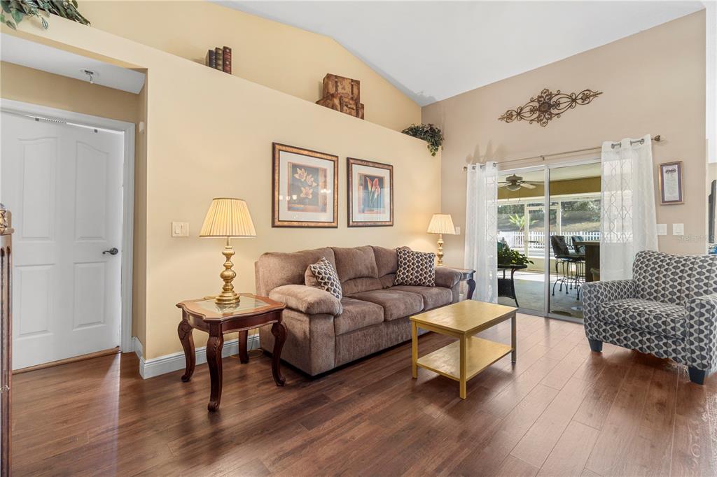 4642 Southwest 100th Lane Ocala, FL 34476 - Photo 12 of 61 a living room with furniture and a large window