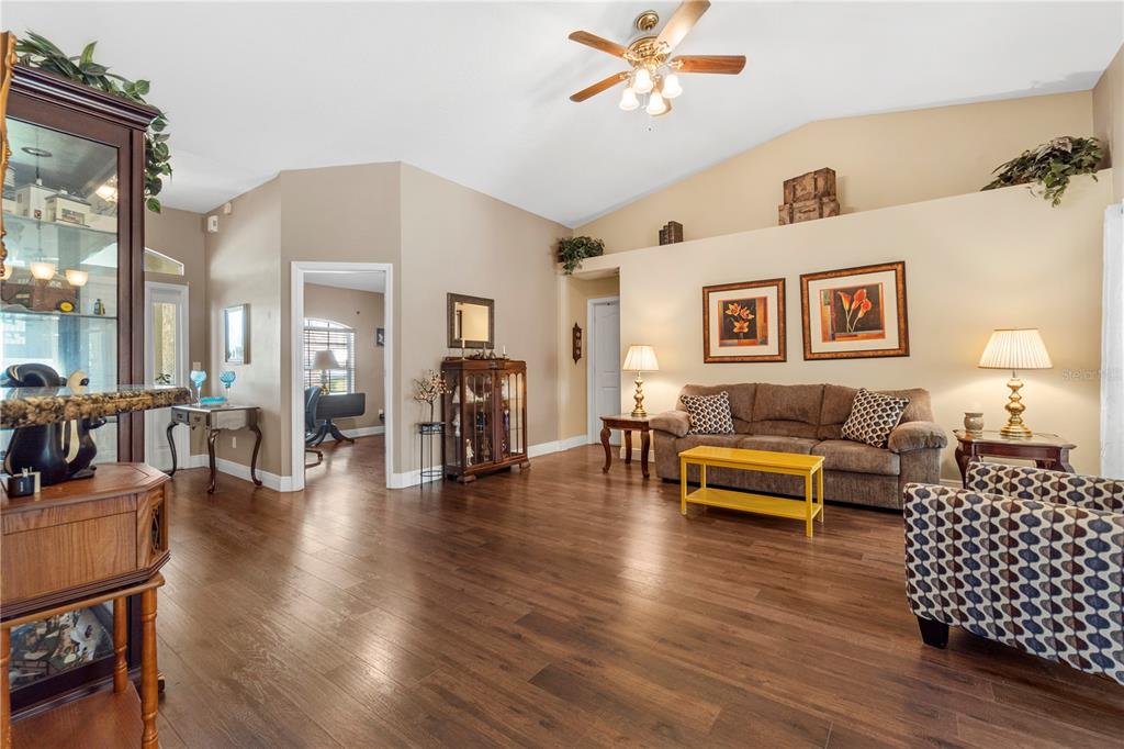 4642 Southwest 100th Lane Ocala, FL 34476 - Photo 13 of 61 a living room with furniture and wooden floor