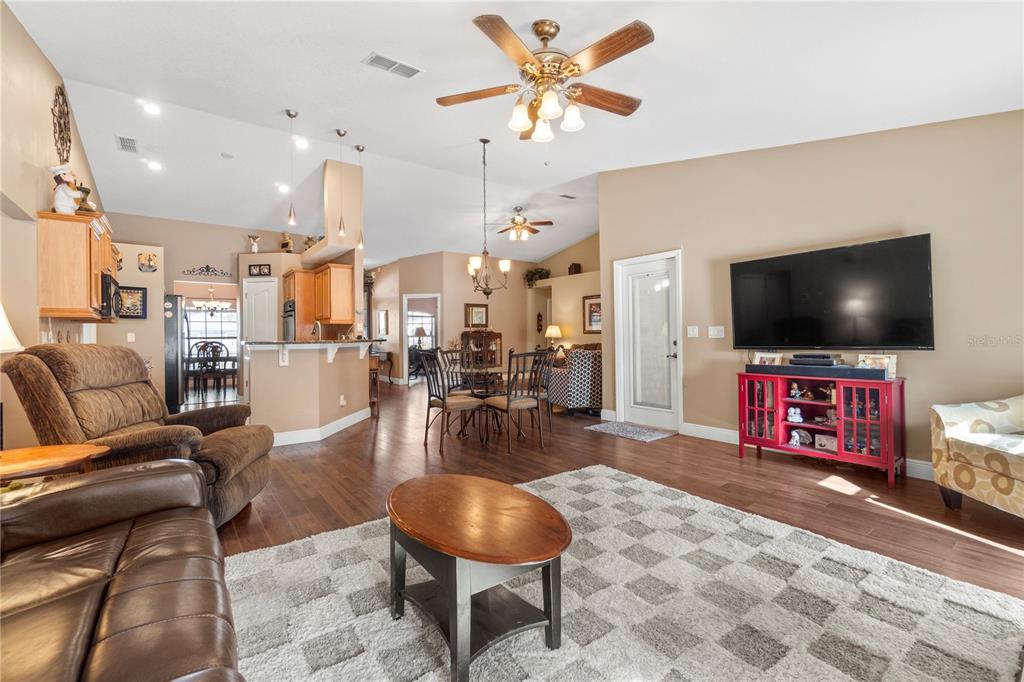 4642 Southwest 100th Lane Ocala, FL 34476 - Photo 16 of 61 a living room with furniture and a flat screen tv