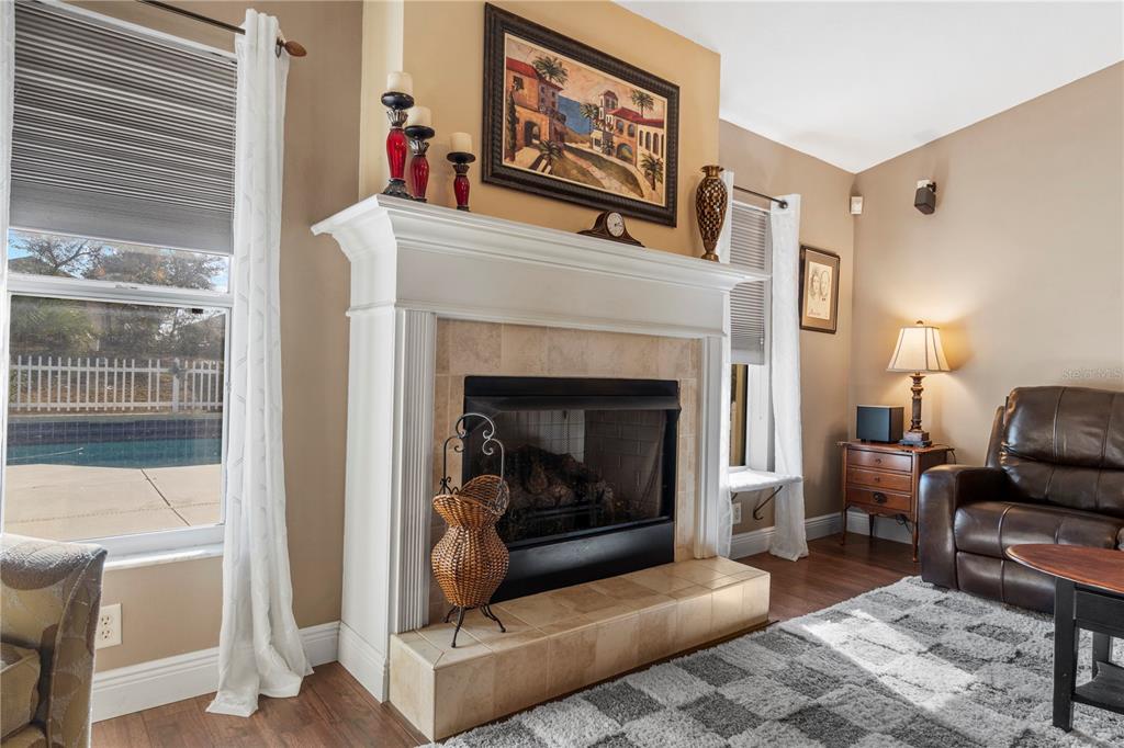 4642 Southwest 100th Lane Ocala, FL 34476 - Photo 17 of 61 a living room with furniture and a fireplace