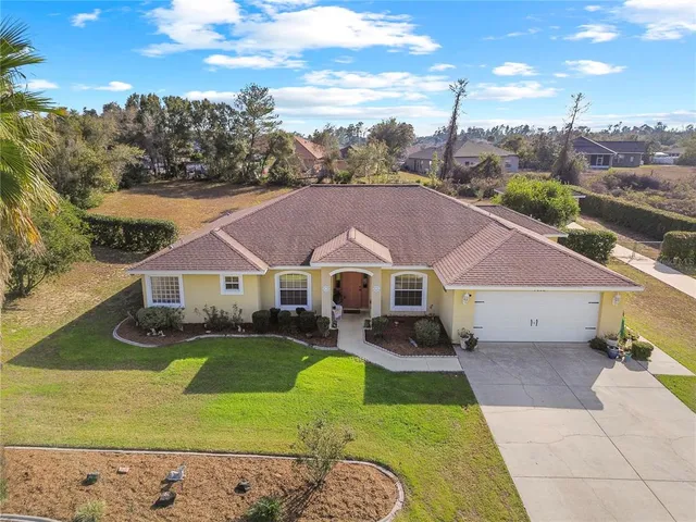 a aerial view of a house with a big yard