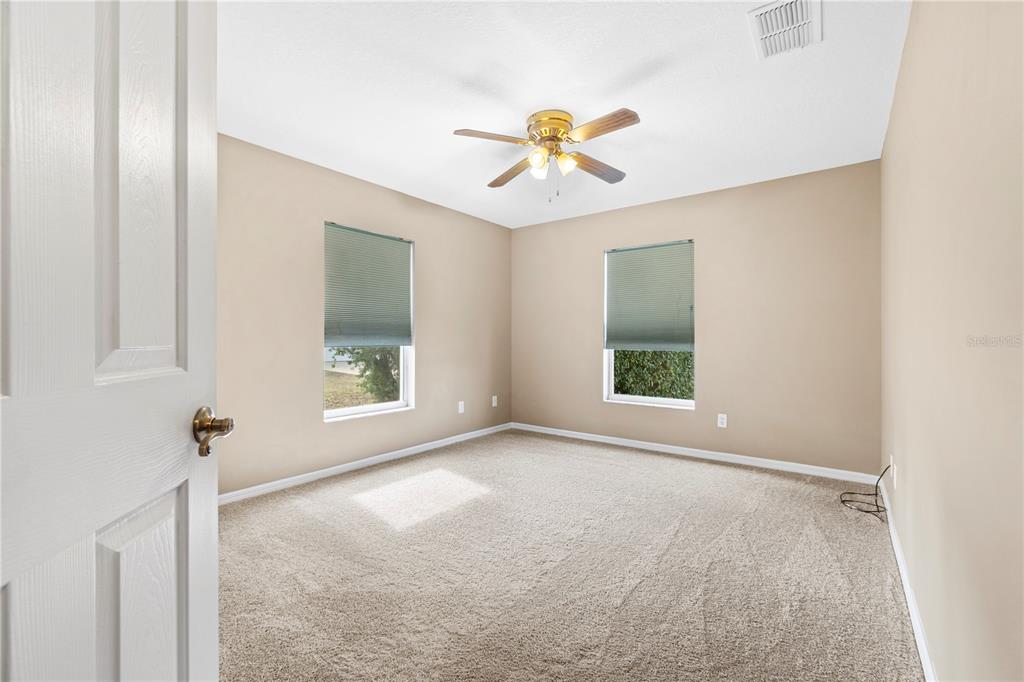 4642 Southwest 100th Lane Ocala, FL 34476 - Photo 23 of 61 a view of an empty room with a window