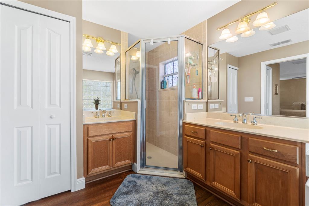 4642 Southwest 100th Lane Ocala, FL 34476 - Photo 35 of 61 a bathroom with a double vanity sink mirror and double