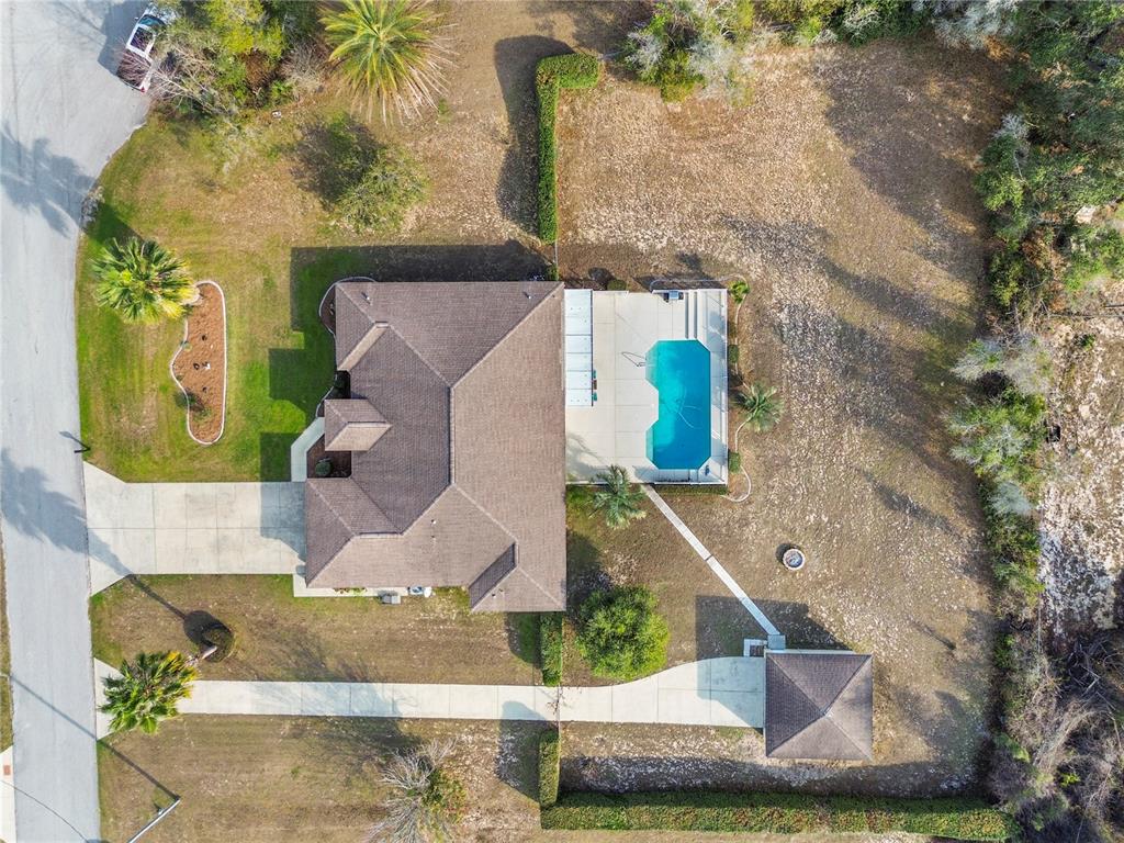 4642 Southwest 100th Lane Ocala, FL 34476 - Photo 61 of 61 an aerial view of a house with a yard