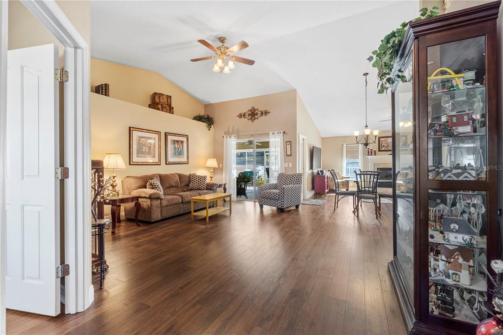 4642 Southwest 100th Lane Ocala, FL 34476 - Photo 7 of 61 a living room with furniture and wooden floor