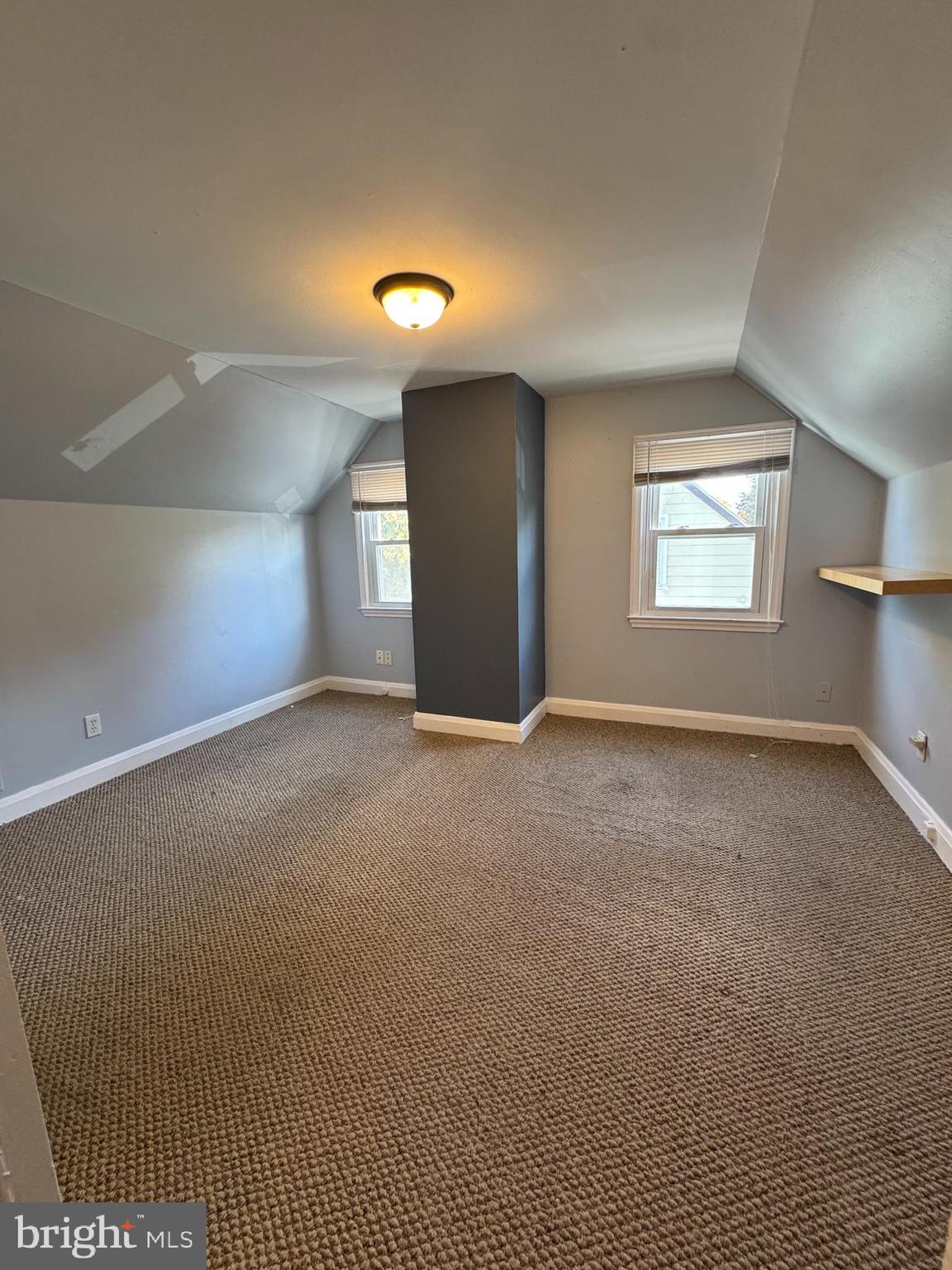 2-7408 Digby Road, Unit 2 Gwynn Oak, MD 21207 - Photo 2 of 12 an empty room with a empty space and windows