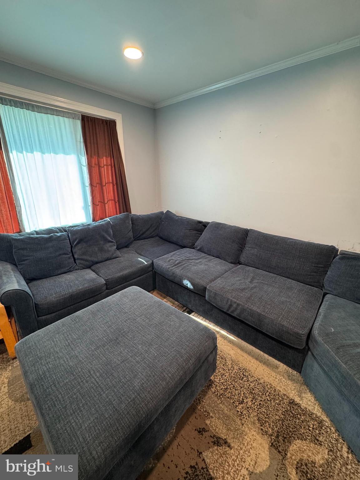 2-7408 Digby Road, Unit 2 Gwynn Oak, MD 21207 - Photo 9 of 12 a living room with furniture and a couch