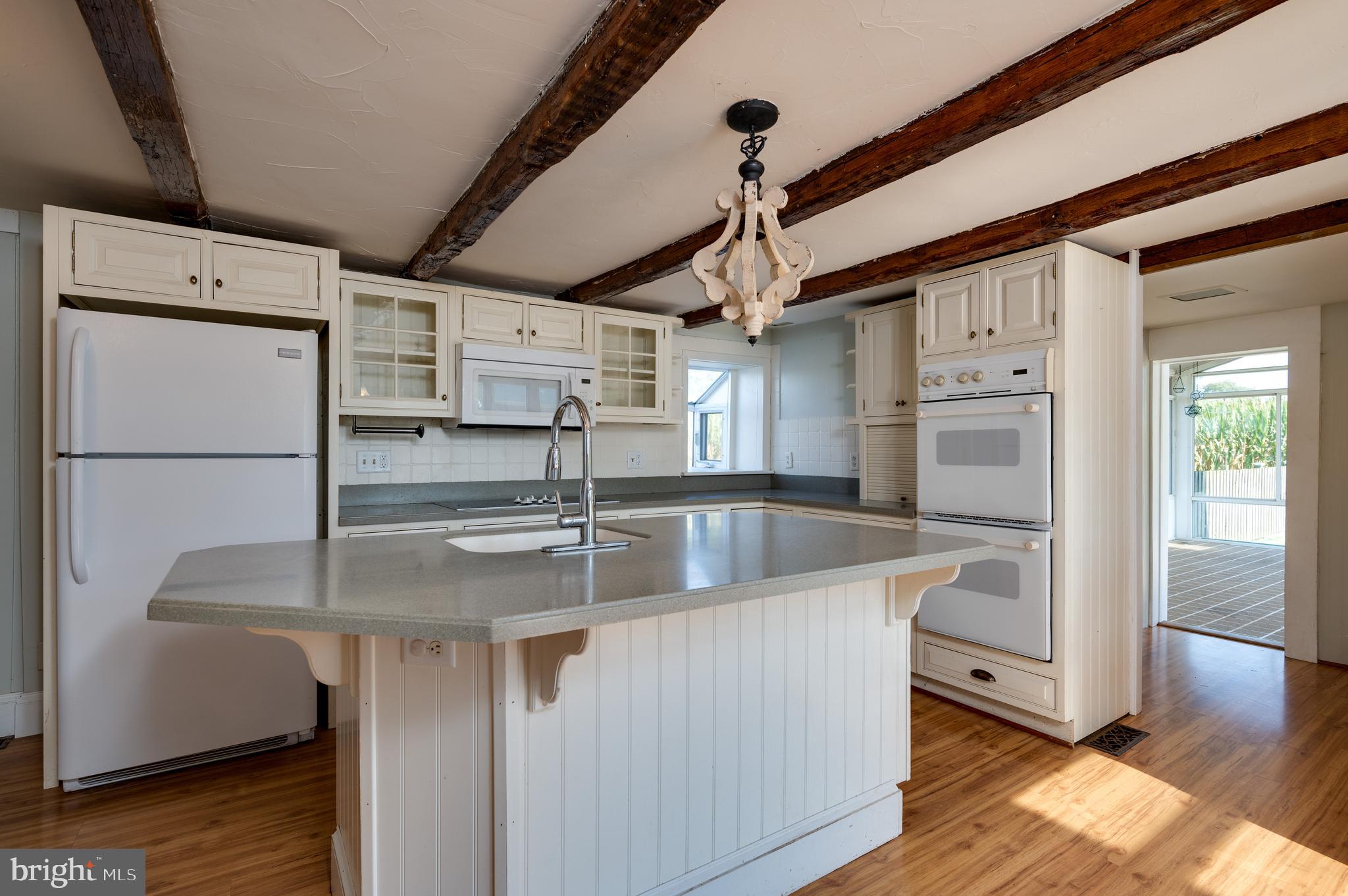 4855 Stonesifer Road Taneytown, MD 21787 - Photo 11 of 65 a kitchen with stainless steel appliances granite countertop a refrigerator a sink and a stove