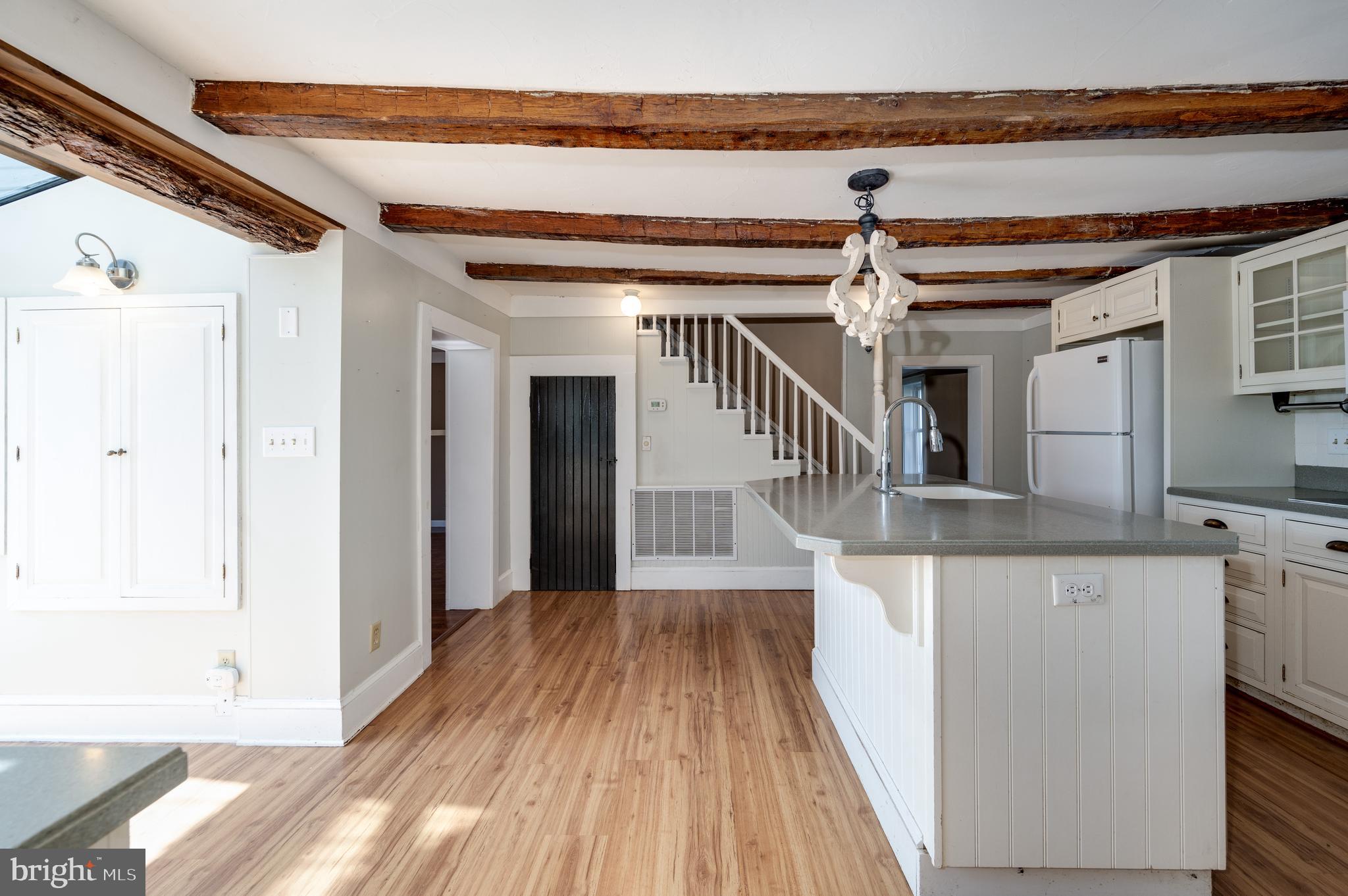 4855 Stonesifer Road Taneytown, MD 21787 - Photo 12 of 65 a view of a hallway with wooden floor and staircase