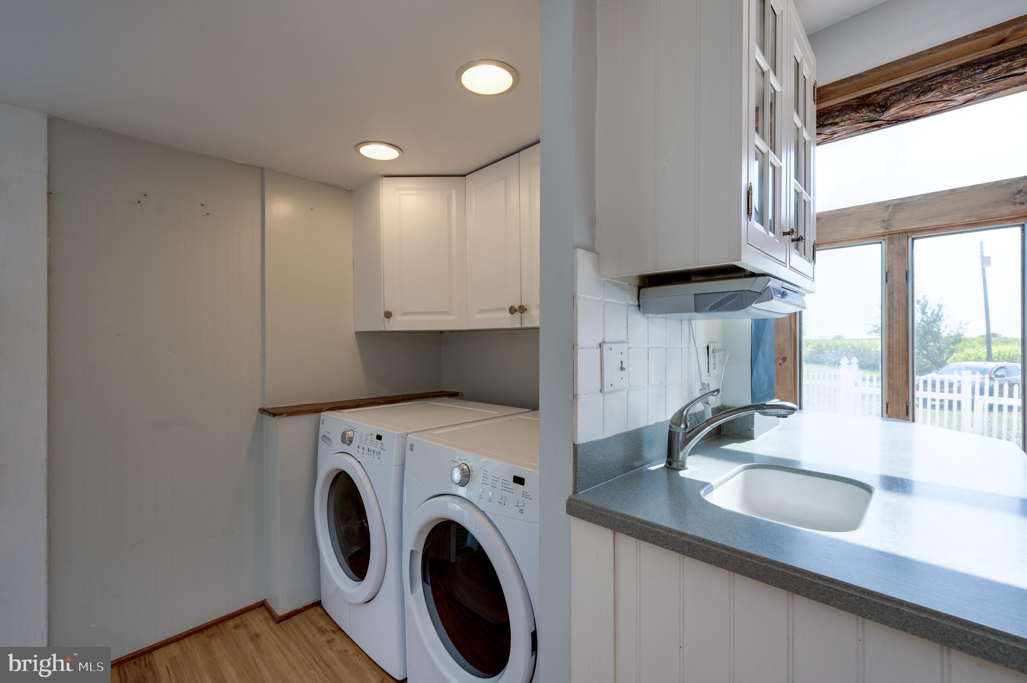 4855 Stonesifer Road Taneytown, MD 21787 - Photo 15 of 65 a view of a kitchen with a sink and a washer dryer