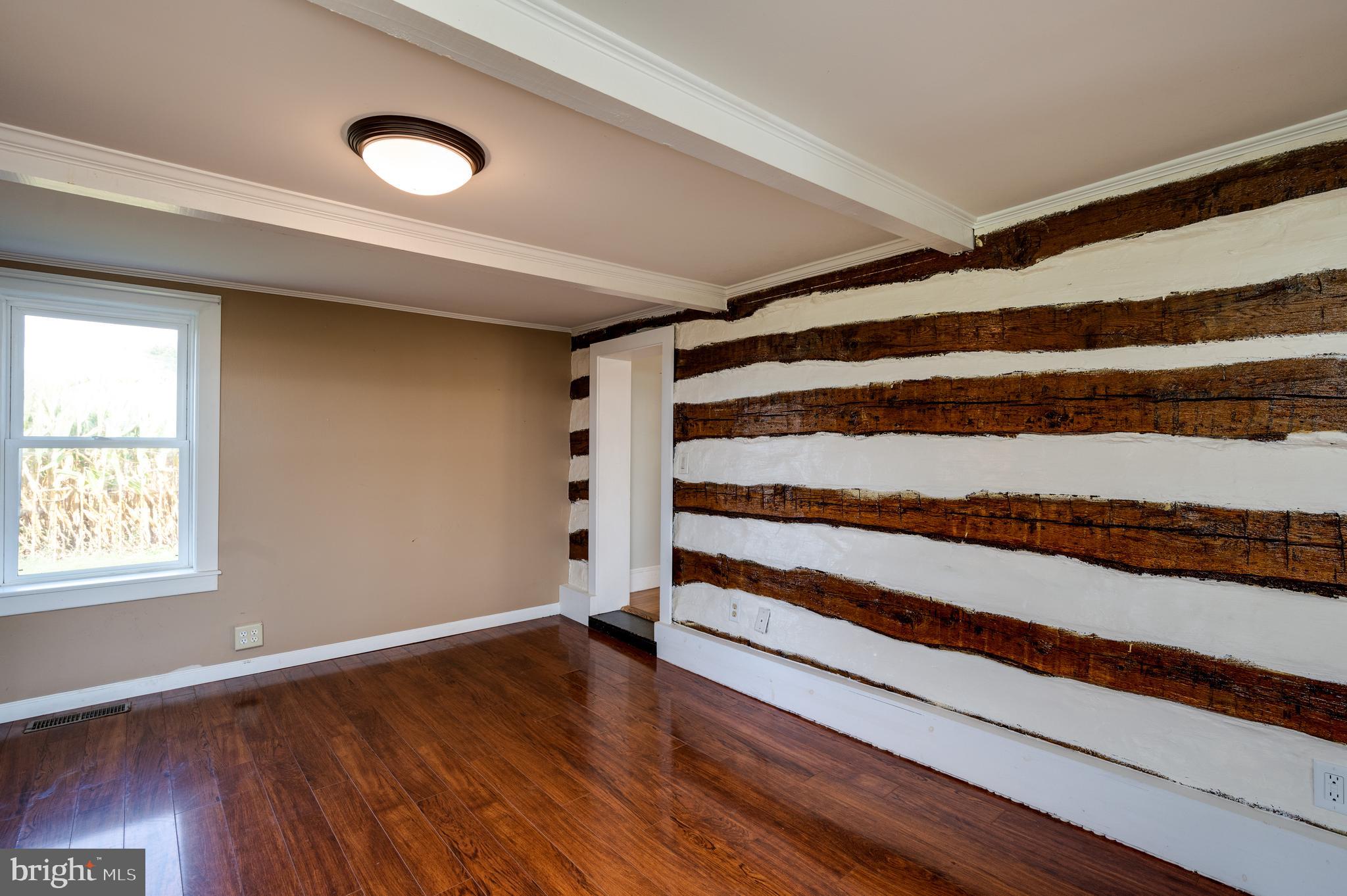 4855 Stonesifer Road Taneytown, MD 21787 - Photo 19 of 65 a view of a livingroom with wooden floor and window