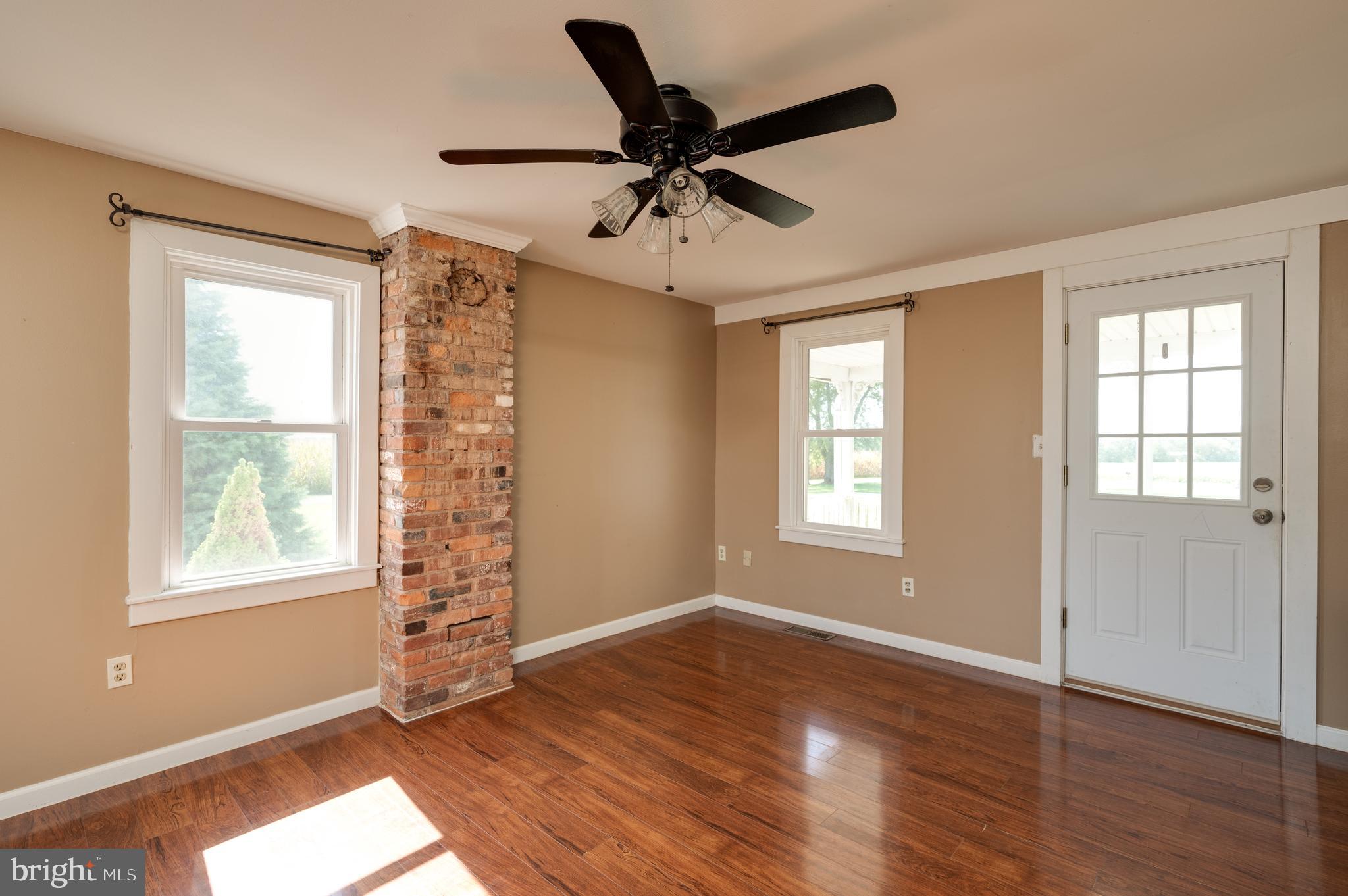 4855 Stonesifer Road Taneytown, MD 21787 - Photo 20 of 65 a view of an empty room with a window and wooden floor