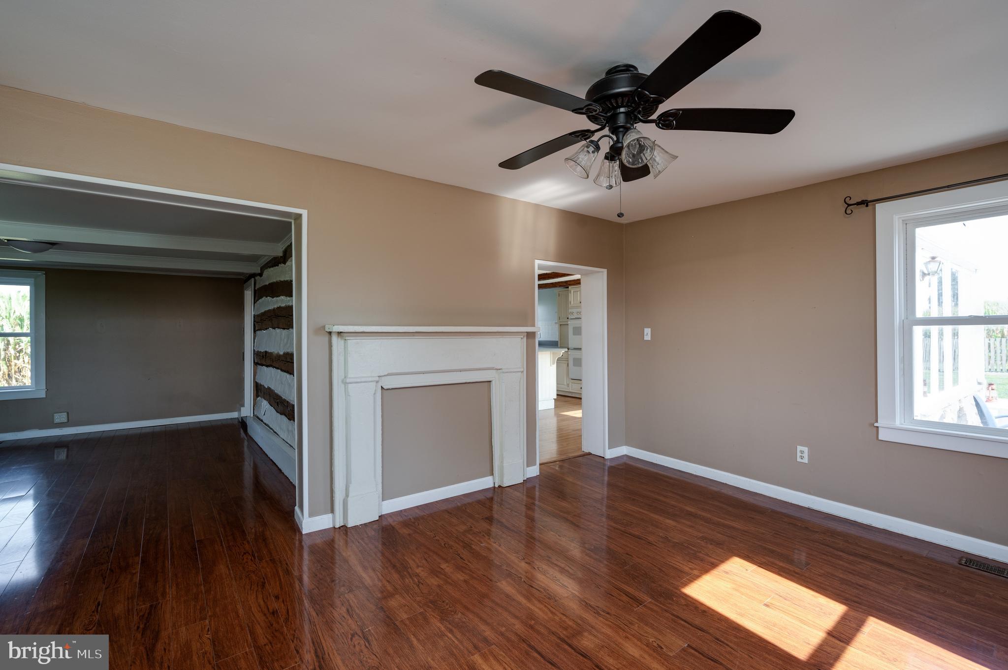 4855 Stonesifer Road Taneytown, MD 21787 - Photo 22 of 65 a view of empty room with wooden floor and fan