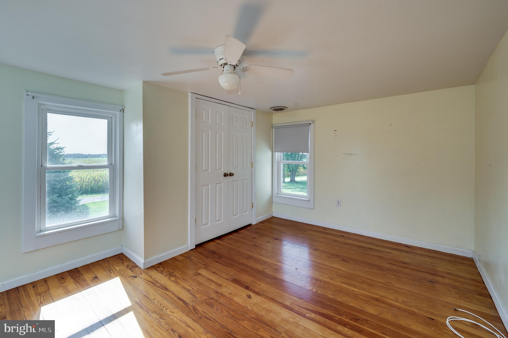 4855 Stonesifer Road Taneytown, MD 21787 - Photo 23 of 65 a view of an empty room with wooden floor and a window