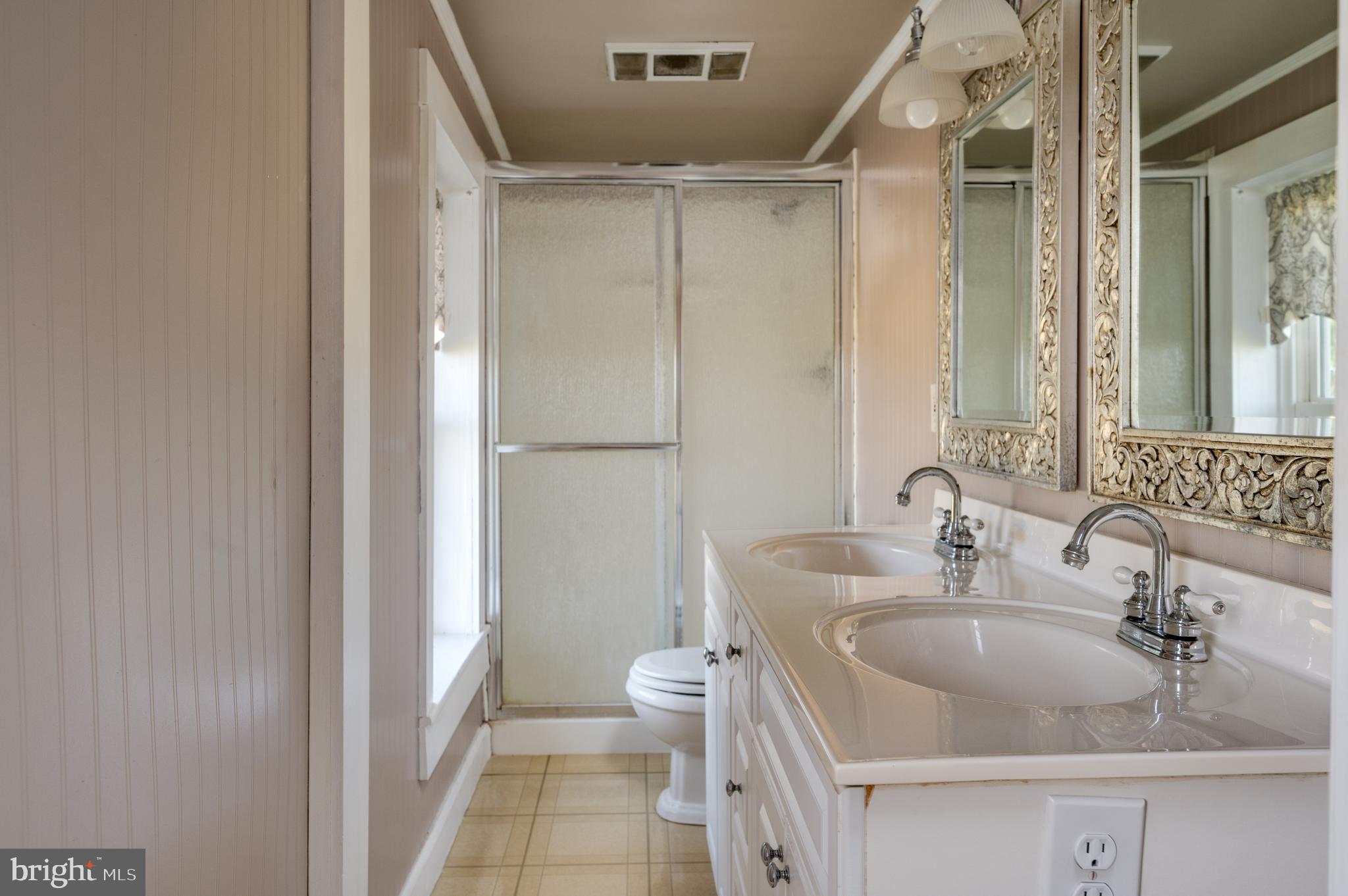 4855 Stonesifer Road Taneytown, MD 21787 - Photo 29 of 65 a bathroom with a sink and a mirror