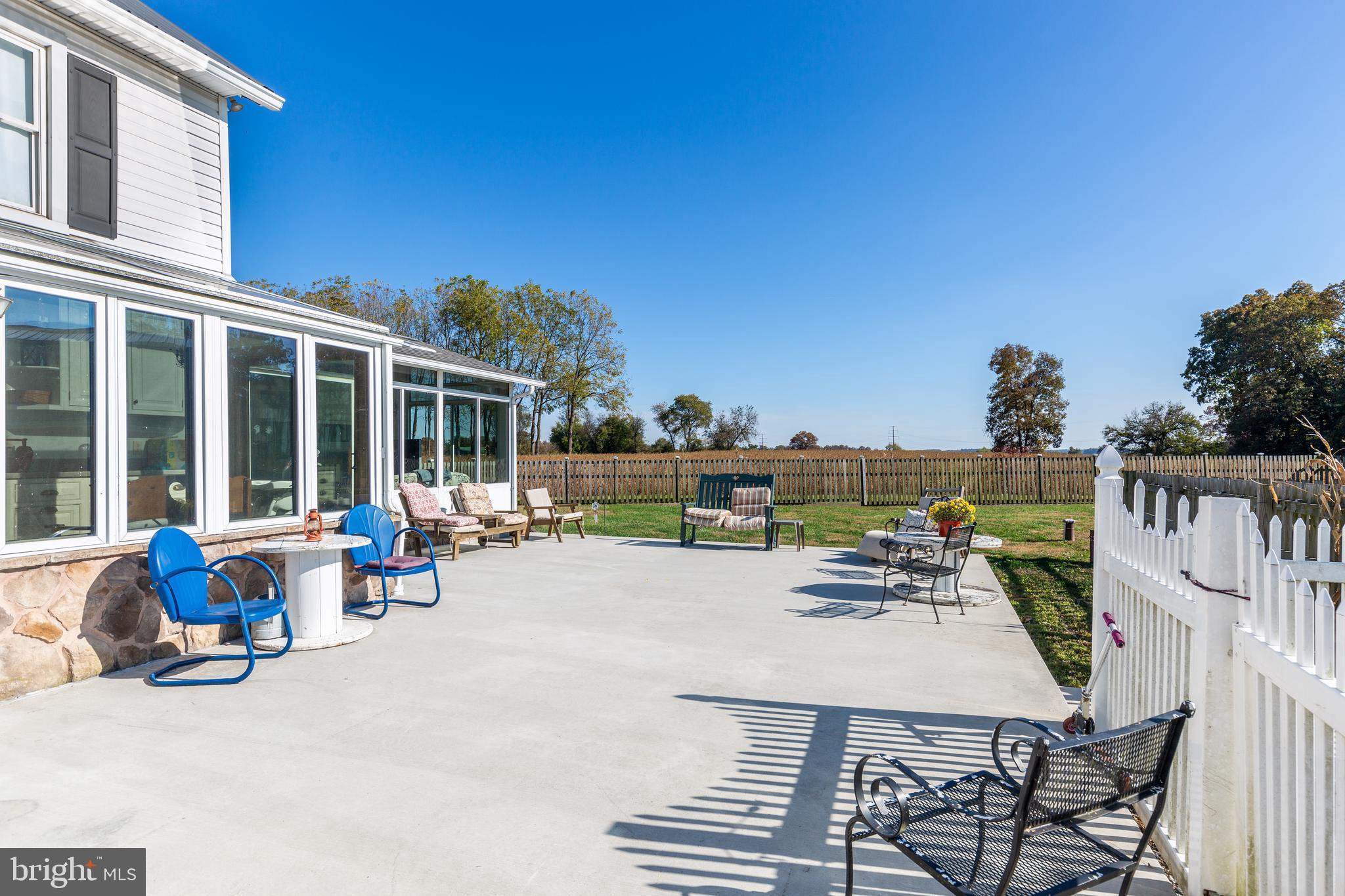 4855 Stonesifer Road Taneytown, MD 21787 - Photo 32 of 65 a view of a patio with chairs and table on the terrace