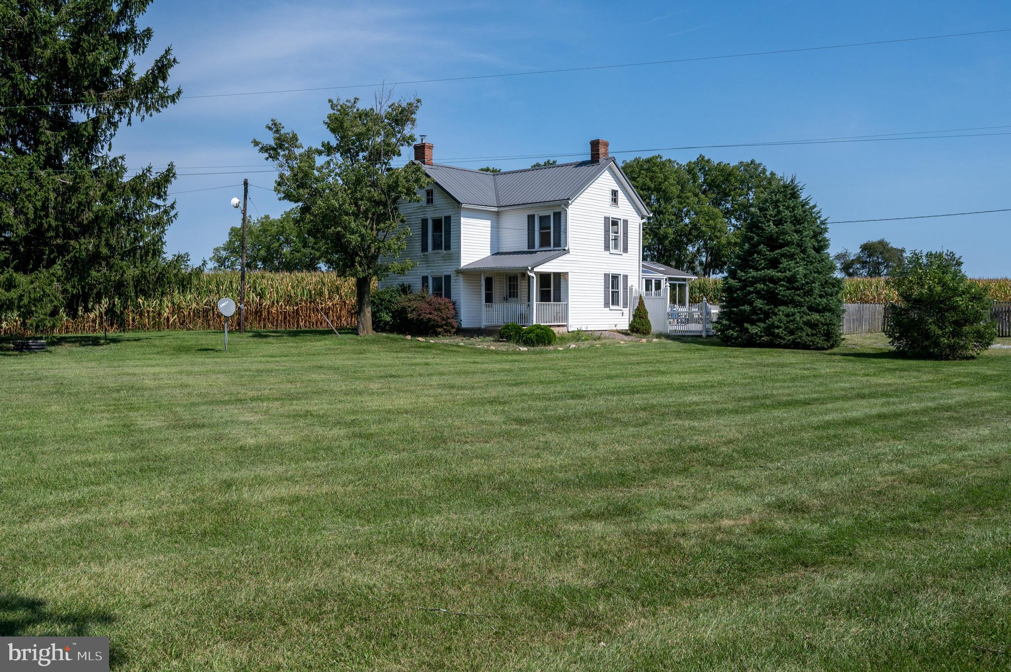 4855 Stonesifer Road Taneytown, MD 21787 - Photo 40 of 65 a view of a white house with a big yard and large trees