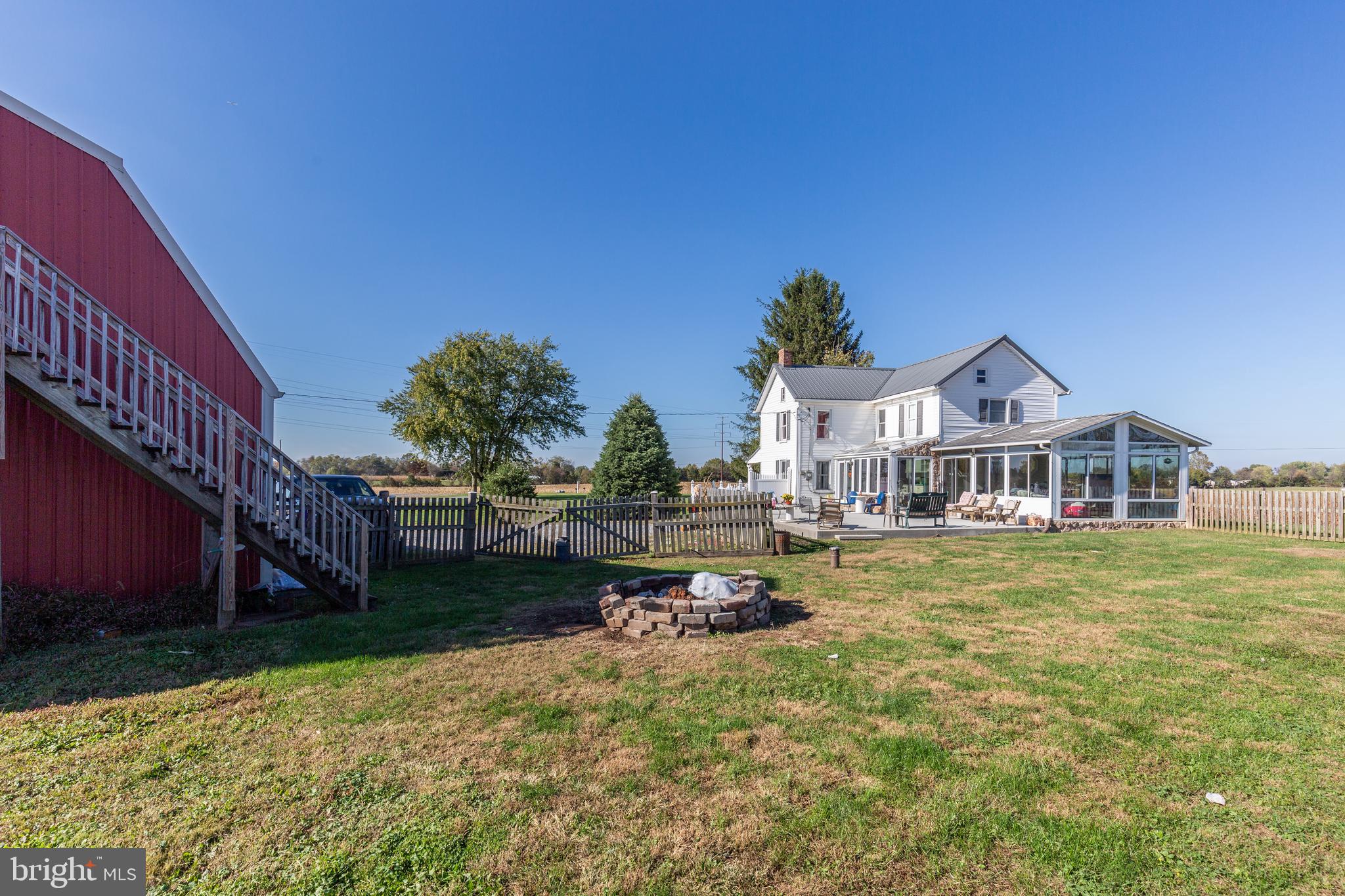 4855 Stonesifer Road Taneytown, MD 21787 - Photo 52 of 65 a small house with a big yard and large trees