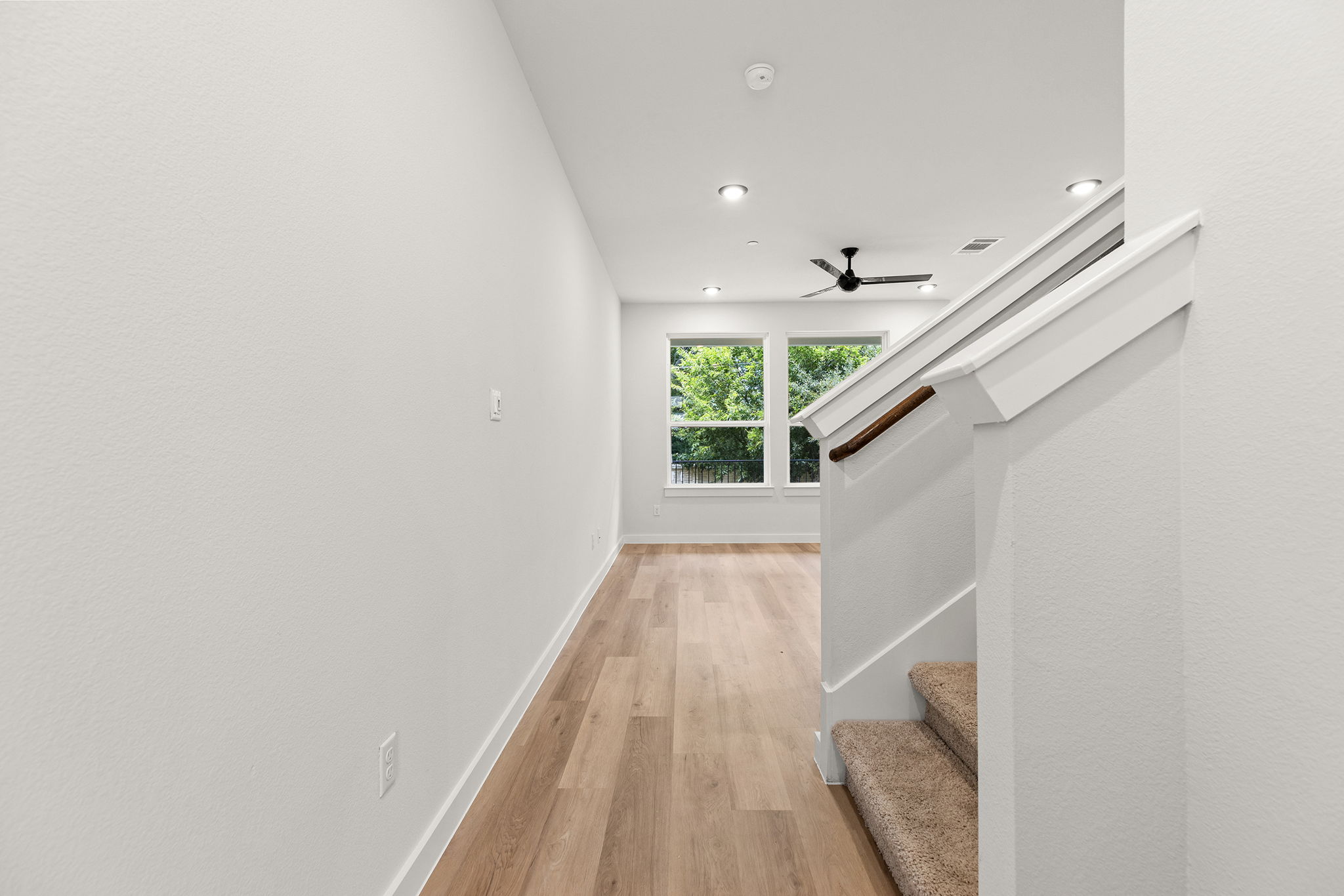 2600 Gattis School Road, Unit 1004 Round Rock, TX 78664 - Photo 13 of 40 A well-lit area with high ceilings, recessed lighting, and a modern ceiling fan.