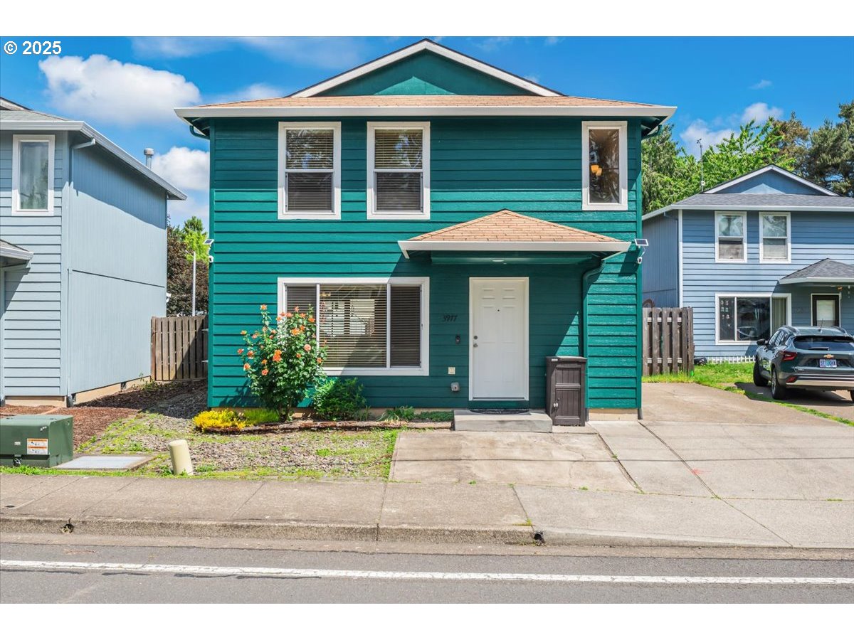 3977 Southeast Salquist Road Gresham, OR 97080 - Photo 1 of 33 a front view of a house with a yard and garage